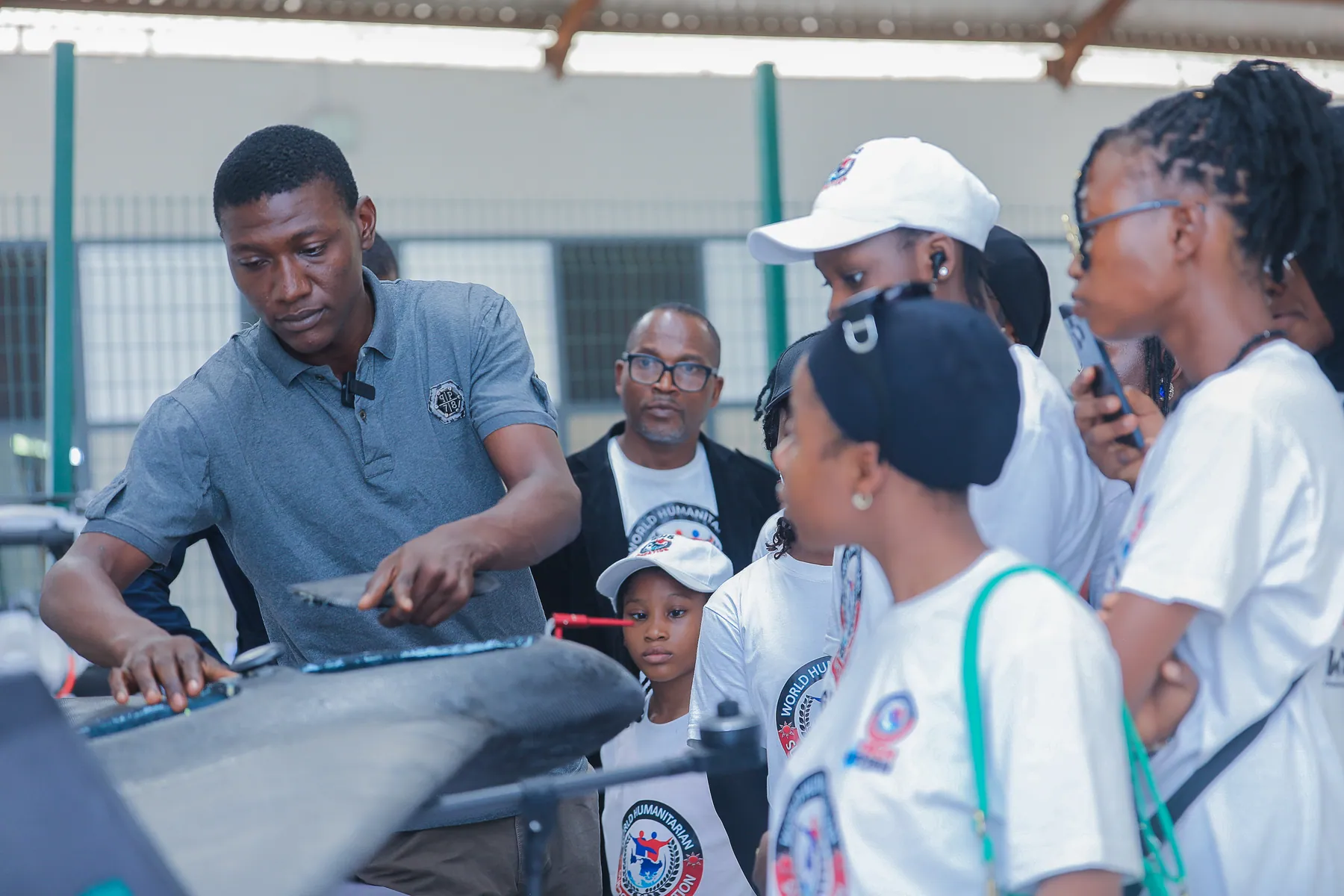 Girls observing an industrial automation demonstration