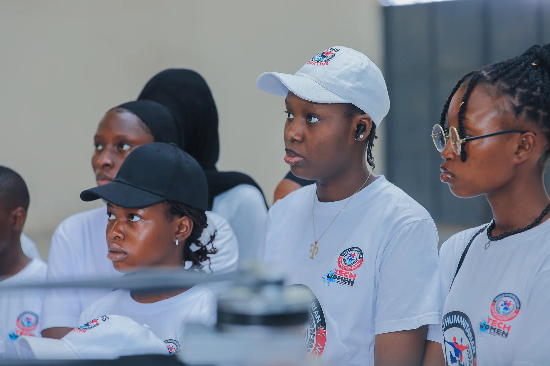 Girls in ICT Club members listening during the technology excursion orientation