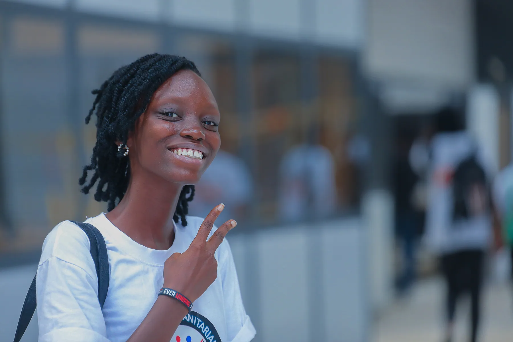 Smiling Girls in ICT Club participant giving a peace sign