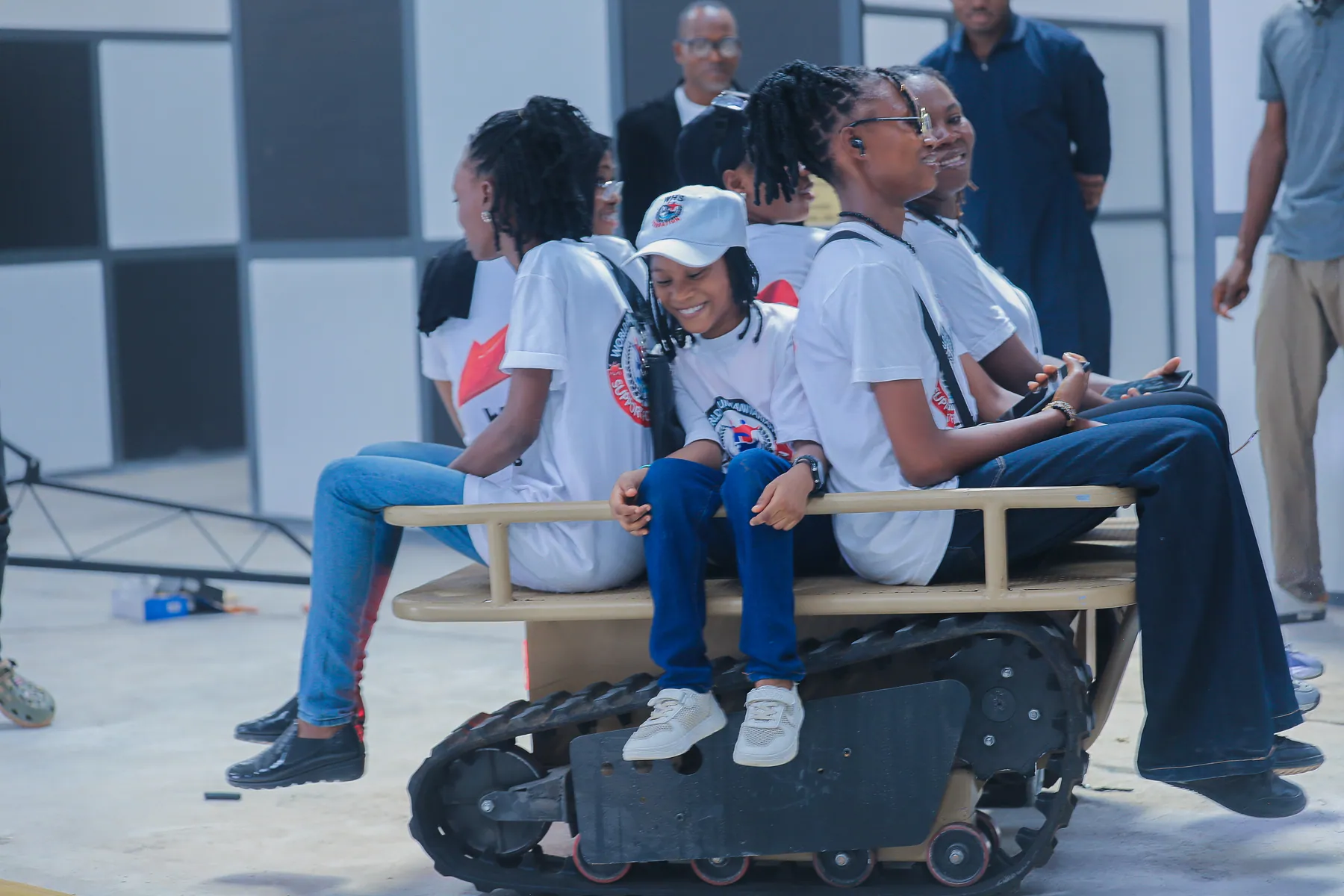 Girls enjoying a ride on a robotic mobility platform