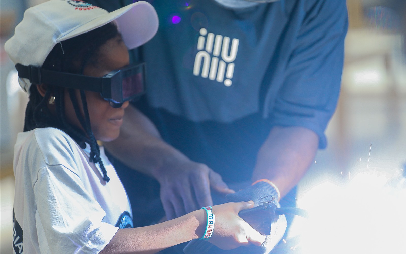 A WHSF girl participating in hands-on technology training